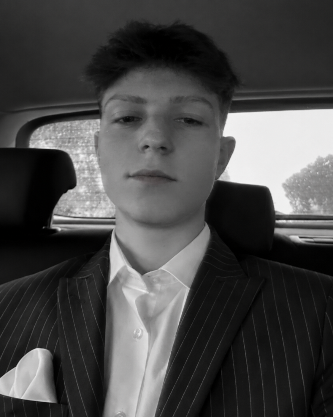 Dimitar Bogoevski wearing a pinstripe suit